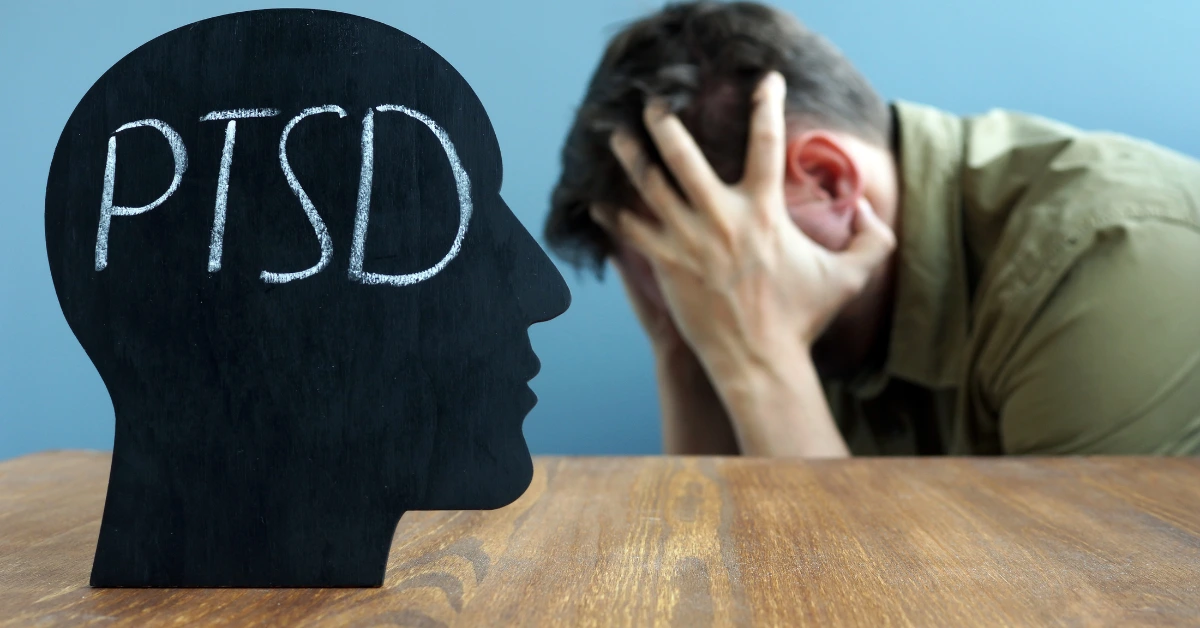 Person experiencing emotional distress beside a PTSD awareness graphic, representing common symptoms of post-traumatic stress disorder such as intrusive memories, anxiety, and emotional overwhelm.
